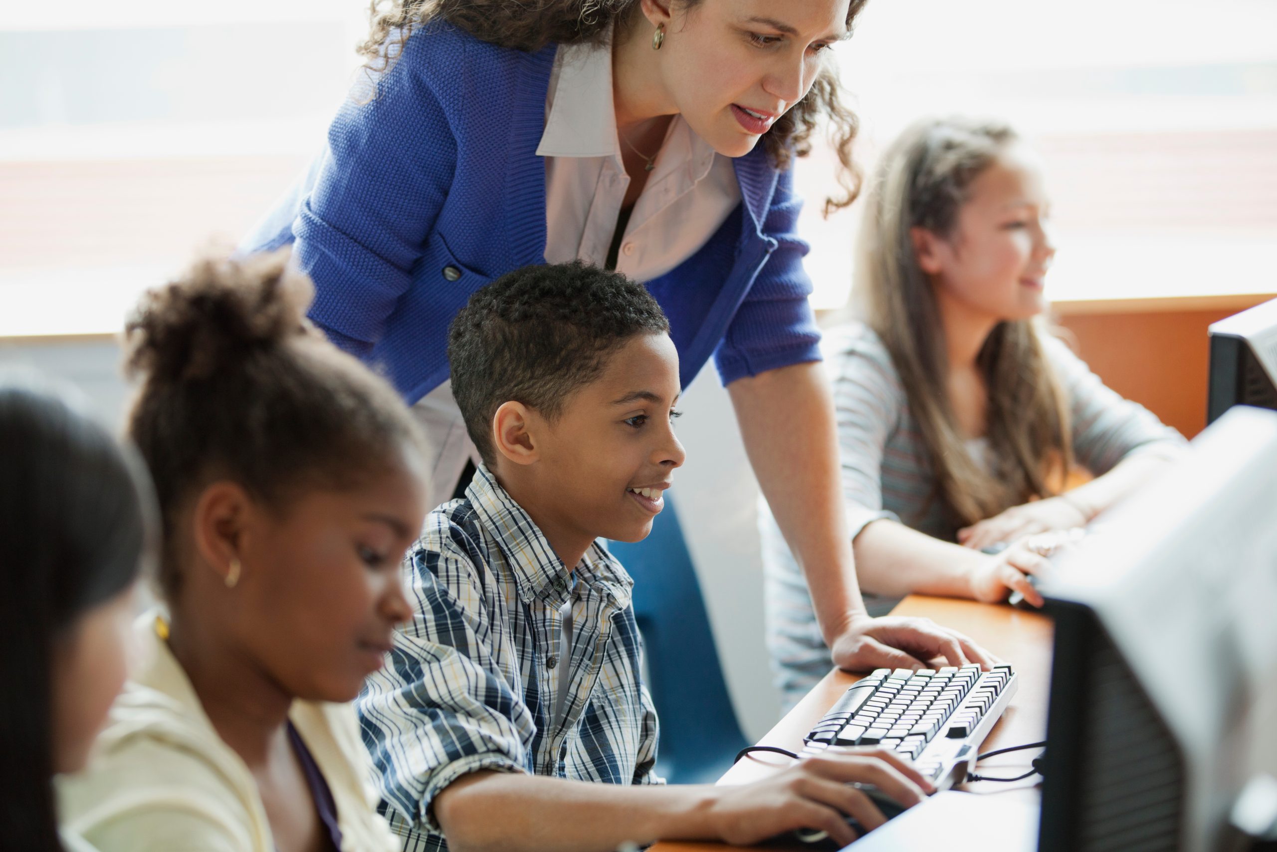 middle school students learning in computer lab